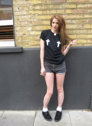 Photo of Maille Doyle Stymest wearing black tops and jeans shorts with black shoes 